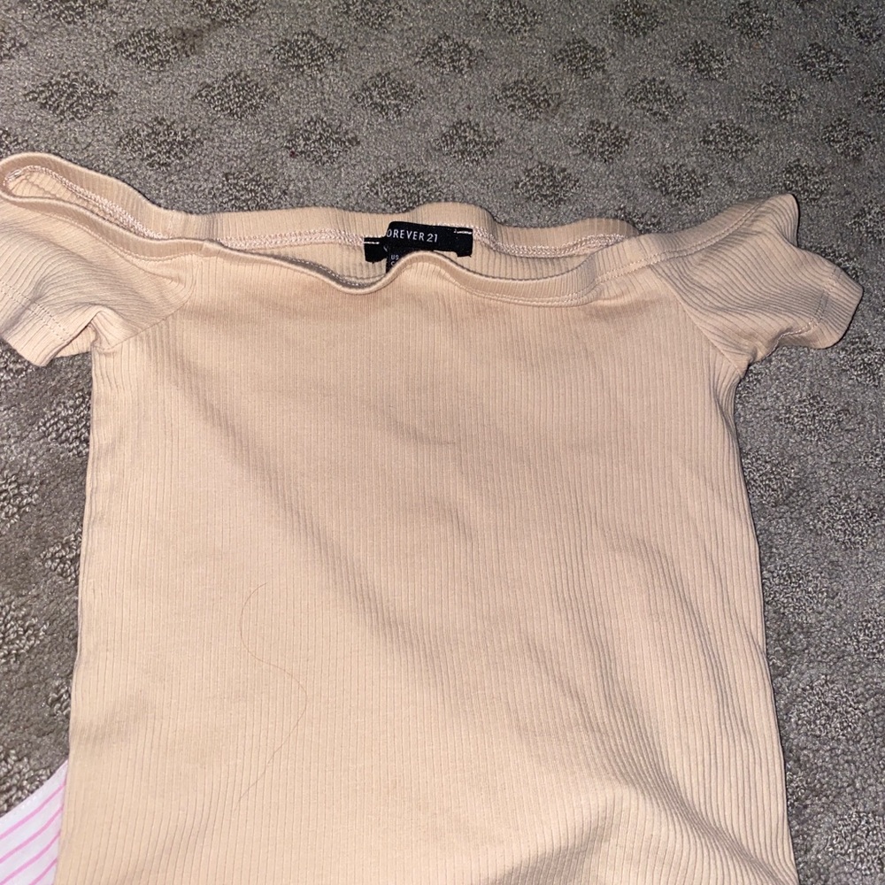 A brown/nude crop top off the shoulder